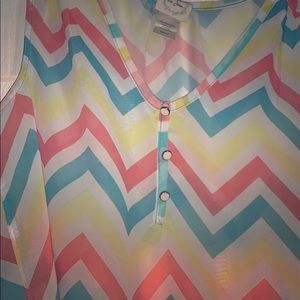 A cute and dressy blouse with no sleeves.